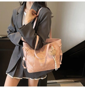 Pink marble pattern tote bag featuring side drawstrings and cute plush bear charm