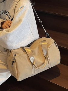 Large beige travel duffel bag with shoe compartment for fitness and sports gym use