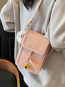 Pink patent leather crossbody phone bag with gold pendant and cute plush monster charm