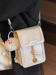 Chic beige crossbody phone bag with glossy pleated leather and golden metal bar detail