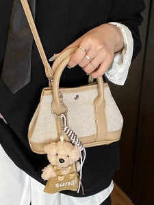 Mini canvas and leather bucket bag with cute bear charm and contrast stitching details