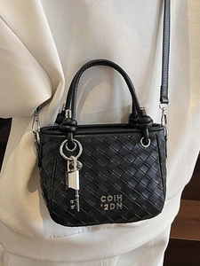 Fashionable black woven leather bucket bag with silver padlock and metal logo detail