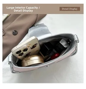Detail view of the spacious pink faux stone texture bag with internal zipper pocket