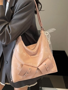 Pink faux leather tote bag for women with pearl bow charm and metal chain accents