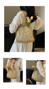 Detail of gold hollow mesh woven tote bag with a cream drawstring pouch for beach