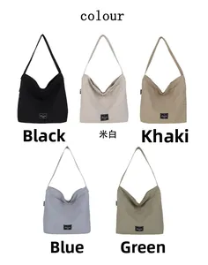 Five color options of minimalist canvas tote bags: black, beige, khaki, blue, and green