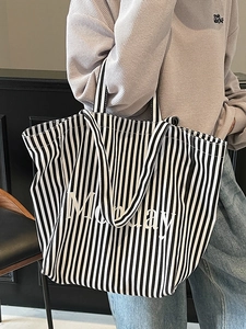 Large black and white striped canvas tote bag with Monday slogan for casual commuting