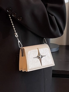 Mini cream patent leather crossbody bag with silver star and ball chain strap