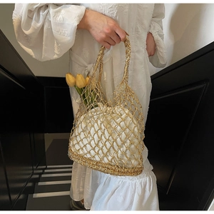 Chic gold metallic hollow woven mesh tote bag with a white drawstring lining detail