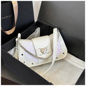 Detail of stone pattern shoulder bag with heart buckle in a premium gift box set