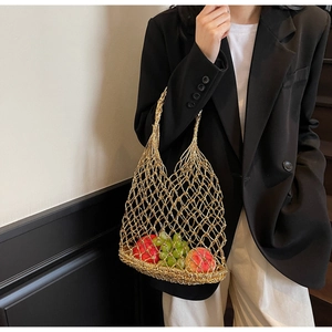 Chic hollow woven mesh tote bag in gold metallic finish with dual handles for beach vacation