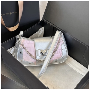 Detailed view of Y2K style pink crocodile texture handbag with heart buckle in a gift box