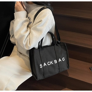 Fashion black canvas SACK BAG tote featuring large capacity and adjustable crossbody strap