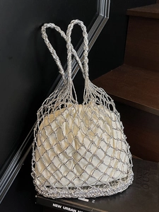 Silver woven mesh tote bag with white drawstring pouch for summer beach vacation