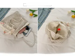 Detail of crochet tote bag with rose embroidery and drawstring inner lining capacity