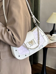 White faux croc underarm bag with purple trim, silver rivets and heart metal buckle