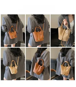 Multi-angle view of mini leather bucket bag with top handle and crossbody strap options