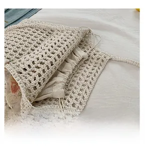 Detail view of the hand-woven mesh bag featuring a secure drawstring cotton inner liner