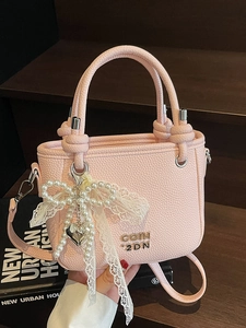 Pink lychee texture leather bucket bag with elegant pearl lace charm and dual handles