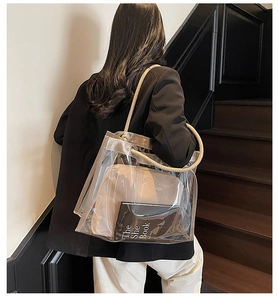 Detail view of transparent PVC tote bag with thick cotton rope handles and canvas inner pouch