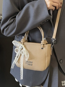 Elegant khaki lychee grain bucket bag with pearl charm and lace bow for women