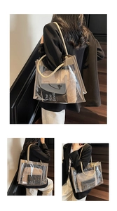 Detailed view of clear PVC tote bag with beige rope handles and inner fabric pouch
