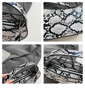 Close-up of snake skin texture and metallic silver zipper details on the retro baguette bag