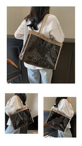 Close-up of clear PVC tote bag with linen edges and thick nautical rope handles