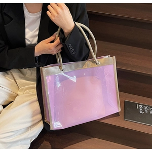 Detail view of purple transparent PVC tote bag with rope handles and inner pouch