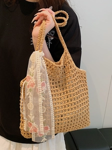 Handmade crochet woven beach bag with floral lace ribbon and hollow mesh texture