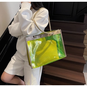 Close-up of neon green transparent tote bag with woven rope handles and inner pouch