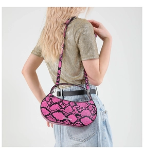 Detailed view of pink python pattern hobo bag texture and FASHION & BAGS branding