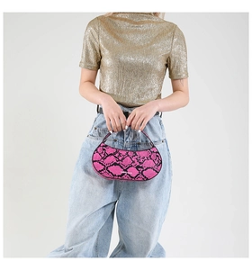 Pink snakeskin pattern crescent handbag with a short fixed handle and chic texture detail