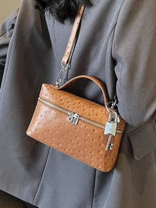 Brown ostrich pattern small square bag with top handle and elegant metal lock charm