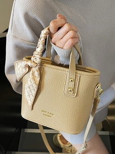 Khaki lychee leather mini bucket bag with silk scarf handle and adjustable shoulder strap