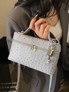 Chic mauve ostrich texture crossbody box bag with top handle and metal lock detail