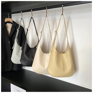 Detailed close-up of high-quality lychee texture leather on diverse hobo tote bags
