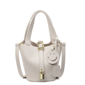 Chic cream litchi grain PU bucket bag with gold padlock and detachable strap