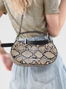Brown faux leather crescent bag with python pattern and adjustable shoulder strap