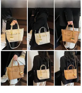 Detail showing beige and brown lychee grain leather tote bags with gold chain charms