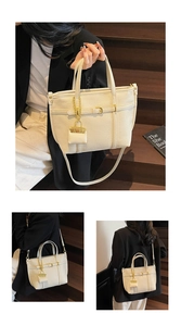 Close-up of beige lychee texture tote bag with golden hardware and mini pouch charm