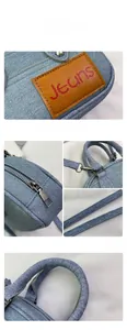 Close-up of denim texture with leather patch and metallic zipper on bowling handbag