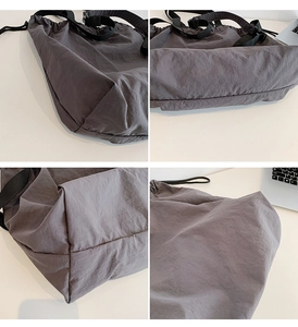 Detalle de costuras y hebilla en bolso hobo de nailon gris carbón con gran capacidad