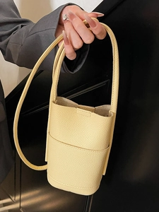 Pale yellow litchi grain PU leather crossbody phone bag with strap and handle