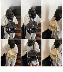 Detail of trendy nylon backpack with flap closure and drawstring on minimalist model