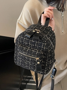 Mini zaino elegante in tweed nero con dettagli dorati e spallacci in pelle