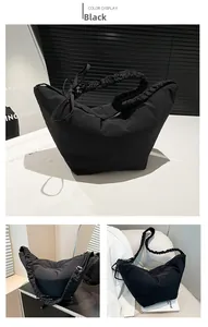 Detail of black nylon pleated shoulder bag with gathered strap and large capacity