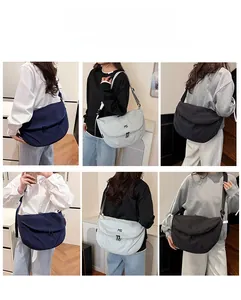 Detailed view of the large capacity crossbody messenger bag with adjustable shoulder strap