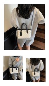 Détail du sac cabas vintage avec motif géométrique noir et lanières en cuir chic