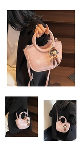 Pink bucket bag with integrated round handle and cute bear charm shown in multiple angles